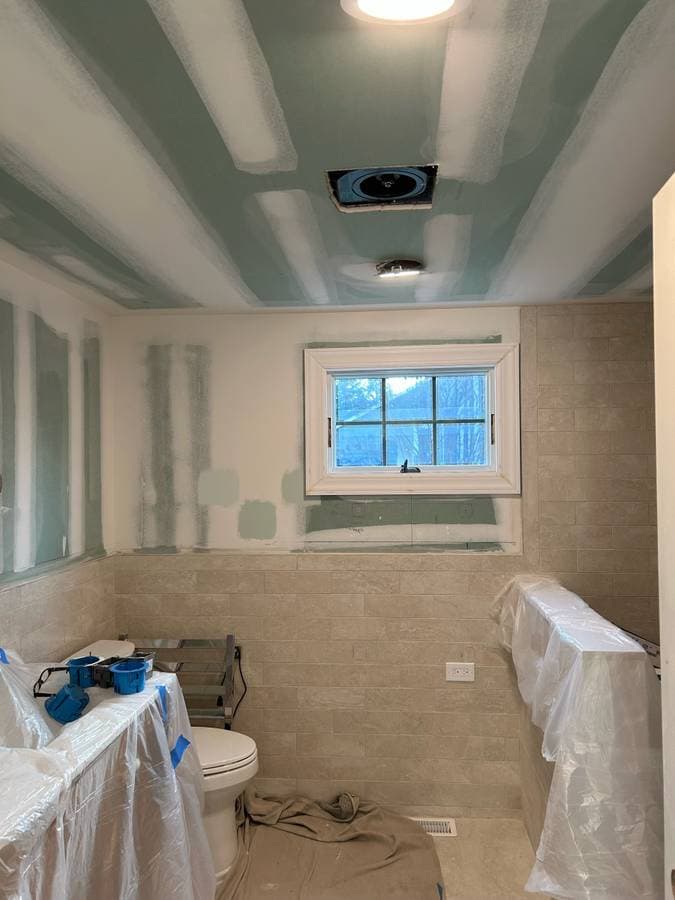 picture of an island park new york long island basement with finished drywall getting ready to be painted 